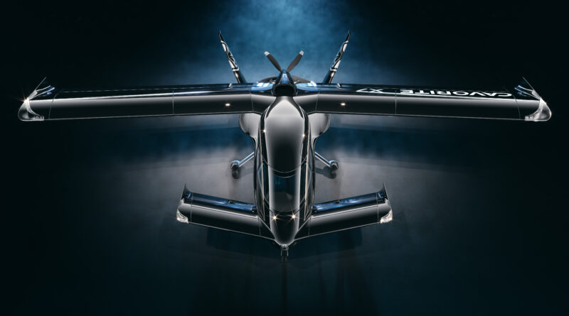 Top-down view of a high-gloss, black aircraft with wide wings and exposed rear engine nacelles against a dark background.