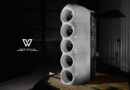 Tall vertical stack of four white turbine fans in a dim hangar, with Jetfoil logo in the lower-left.