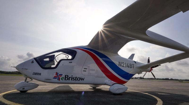 Small white light aircraft on a tarmac with red–blue stripes and sun bursting behind the wing behind the cockpit window area.