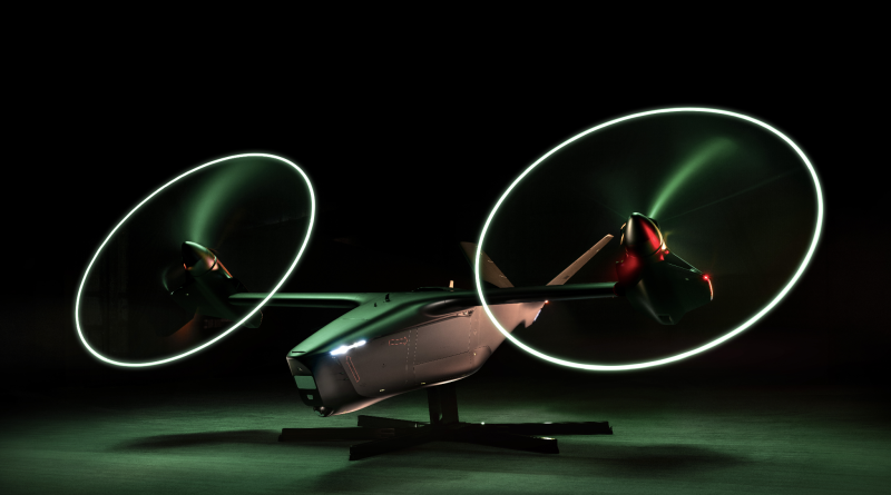 Futuristic aircraft on a stand at night with neon green propeller rings in motion.