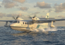 unnamed 2 - eVTOL Insights Twin-engine seaplane skimming the ocean at takeoff, propellers blurred with motion