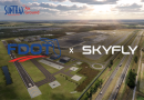 Aerial view of a runways and airport campus with FDOT x SkyFly branding and Suntrax logo above.